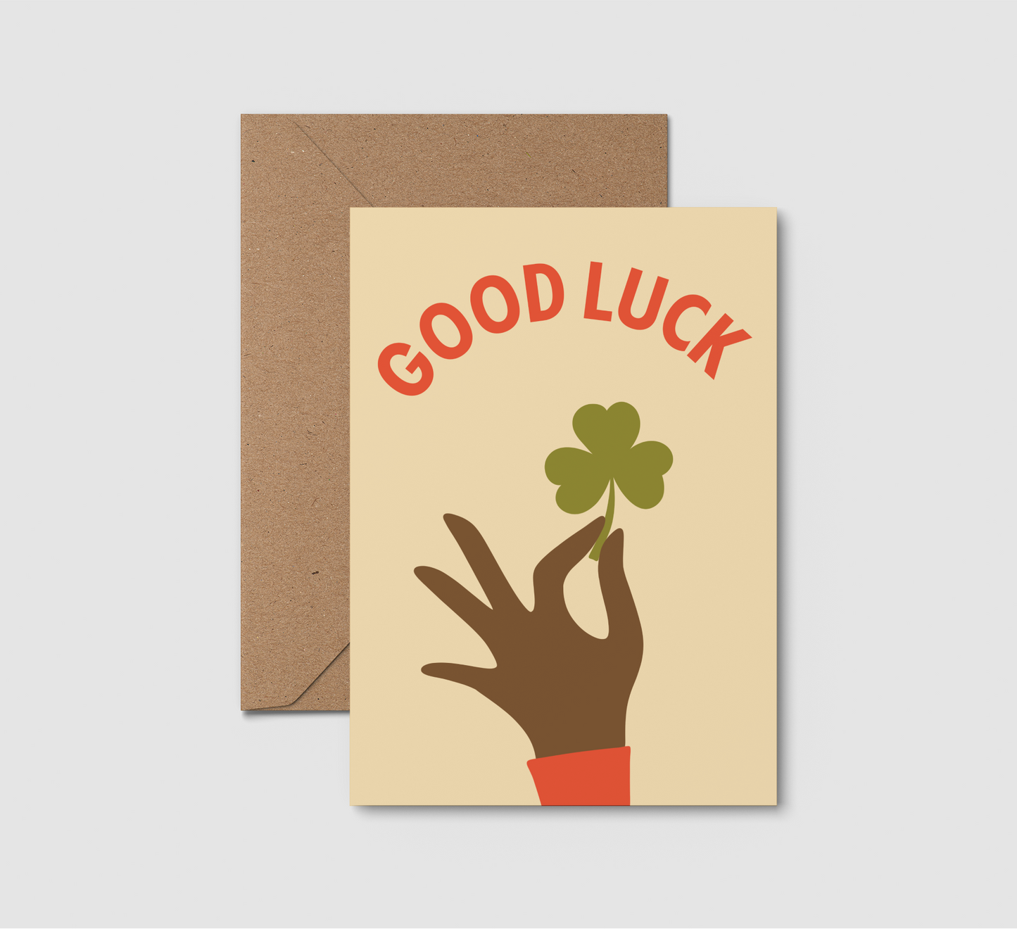 Good Luck card. Hand holding a three leaf clover